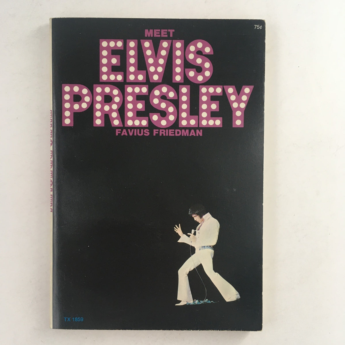 1973 Vintage Book Meet Elvis Presley by Favius Friedman, featuring the vibrant cover with Elvis Presley in a performance pose and bold title design.