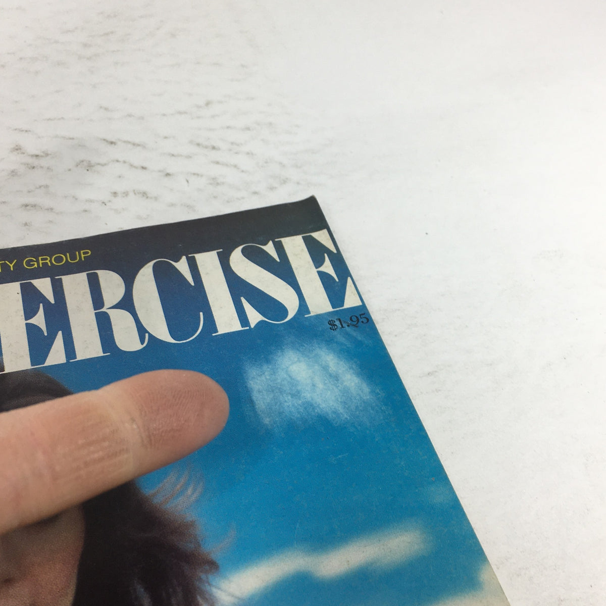 Close-up of the cover of the VTG Diet & Exercise Magazine: April 1980 featuring bold text and a price of $1.95, highlighting the vintage aesthetic and cultural nostalgia.