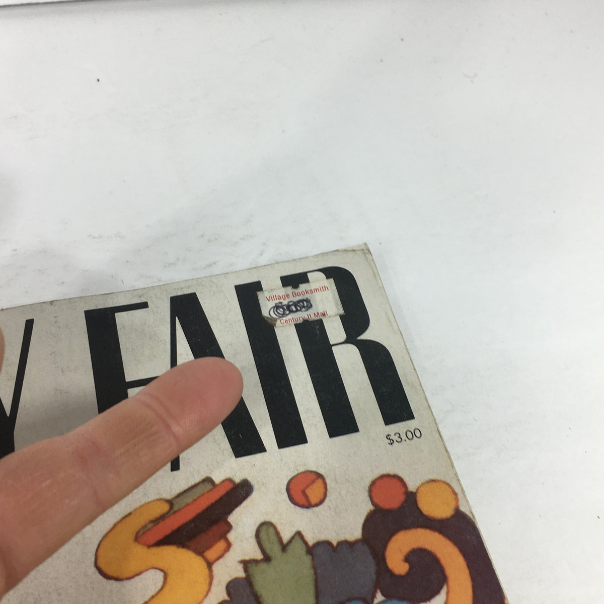 Close-up view of the cover of VTG Vanity Fair Magazine: March 1983 - First Issue After Relaunch, showcasing a price tag from a bookstore.