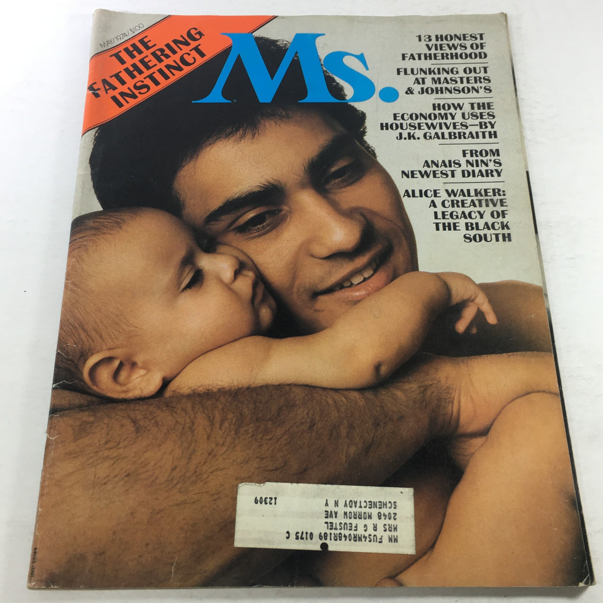 Cover of VTG MS. Magazine: May 1974 featuring 'The Fathering Instinct' article with a poignant image of a father and baby, highlighting themes of fatherhood and masculinity.