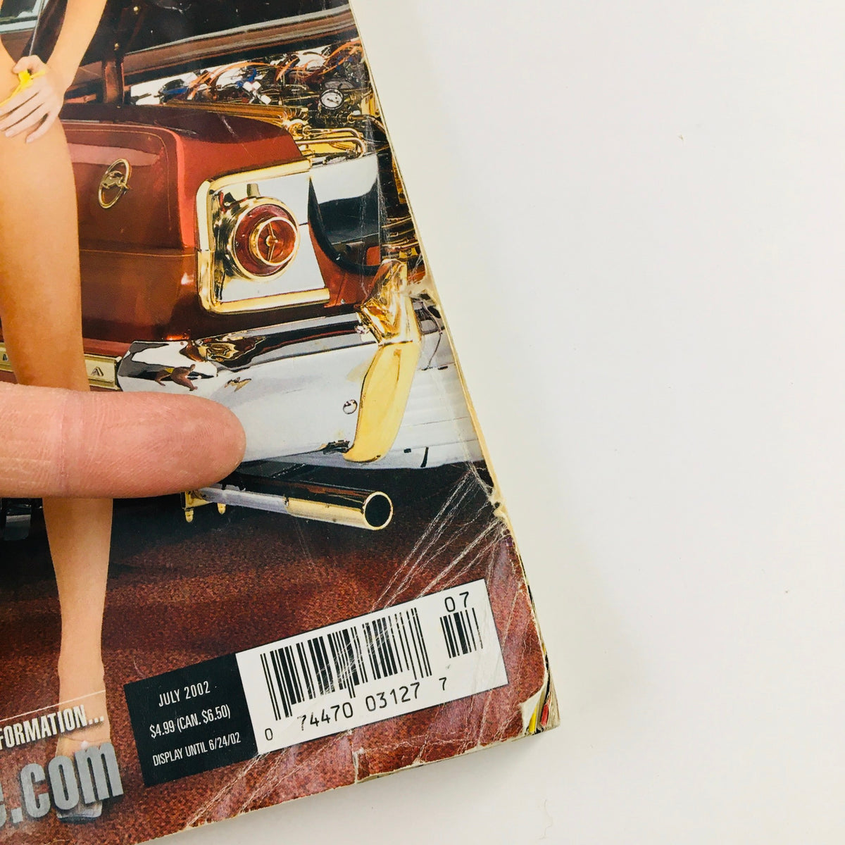 Back cover of LowRider Magazine July 2002, highlighting the magazine's barcode and details about car care. The magazine focuses on America's Top Lows including the iconic Evil 63.