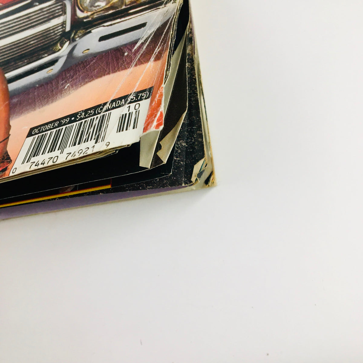 Side view of LowRider Magazine October 1999 showing minor wear and tear, confirming its vintage authenticity and collectible value.