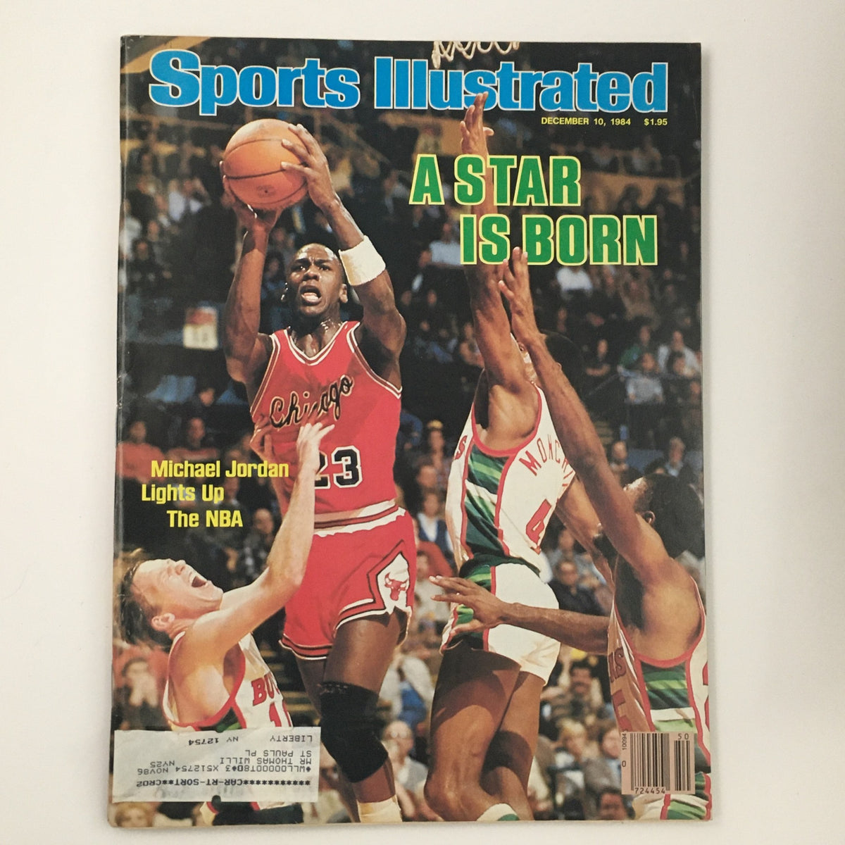 Sports Illustrated Magazine December 10, 1984, featuring Michael Jordan on the cover, showcasing his rise to fame in the NBA with the headline 'A Star is Born'. The cover displays Jordan in a Chicago Bulls uniform as he prepares to shoot, surrounded by opposing players.