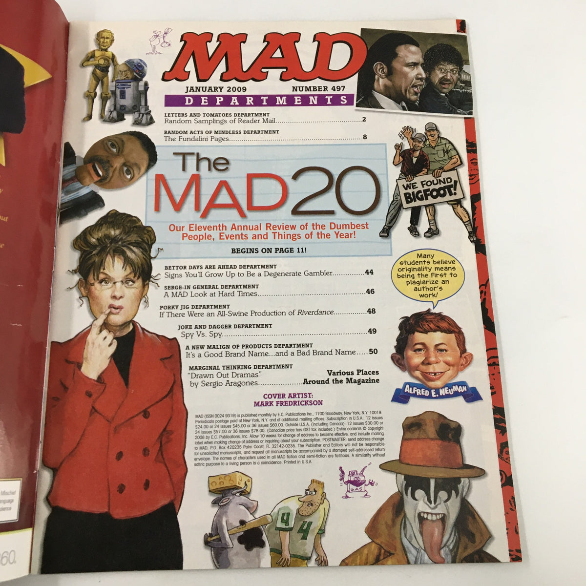 Inside page of Mad Magazine January 2009 No. 497 with illustrations depicting a review of the year's dumbest people, events, and things, featuring iconic characters and humor.