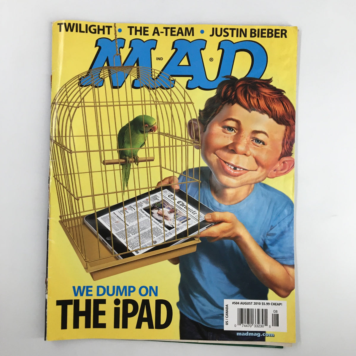 Cover of Mad Magazine August 2010 No. 504 featuring a character holding a birdcage with a parrot and the headline "We Dump On The iPad", highlighting the magazine's satirical take on technology.