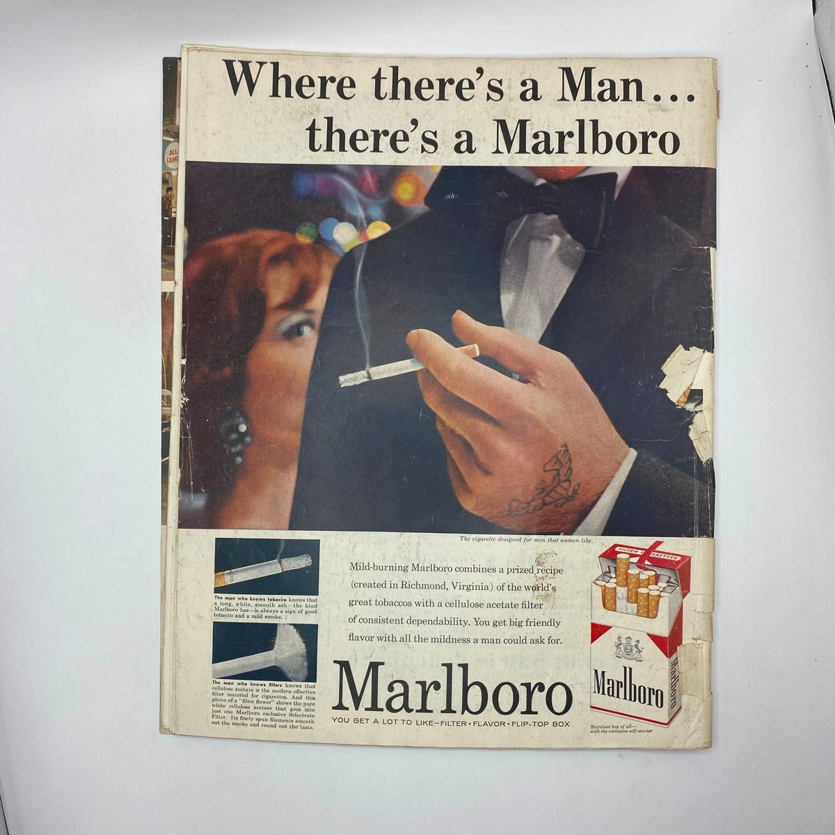 Back cover of the Saturday Evening Post Magazine March 8, 1958, featuring a Marlboro cigarette advertisement with a dapper man holding a cigarette.
