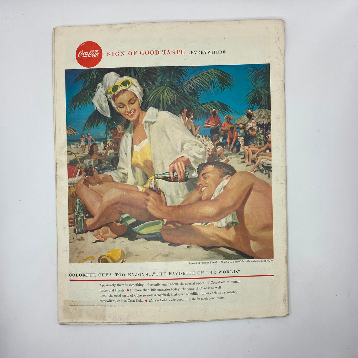 Back cover of Saturday Evening Post Magazine January 18 1958 featuring a Coca-Cola advertisement with a colorful beach scene.