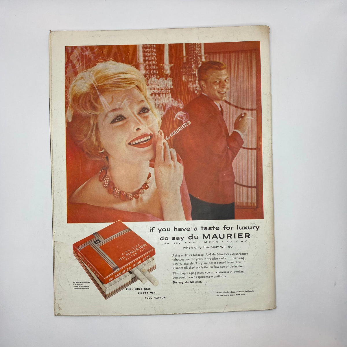 Back cover of the Saturday Evening Post Magazine September 6, 1958, featuring an advertisement for du Maurier cigarettes with a stylish woman and a man in a formal setting.