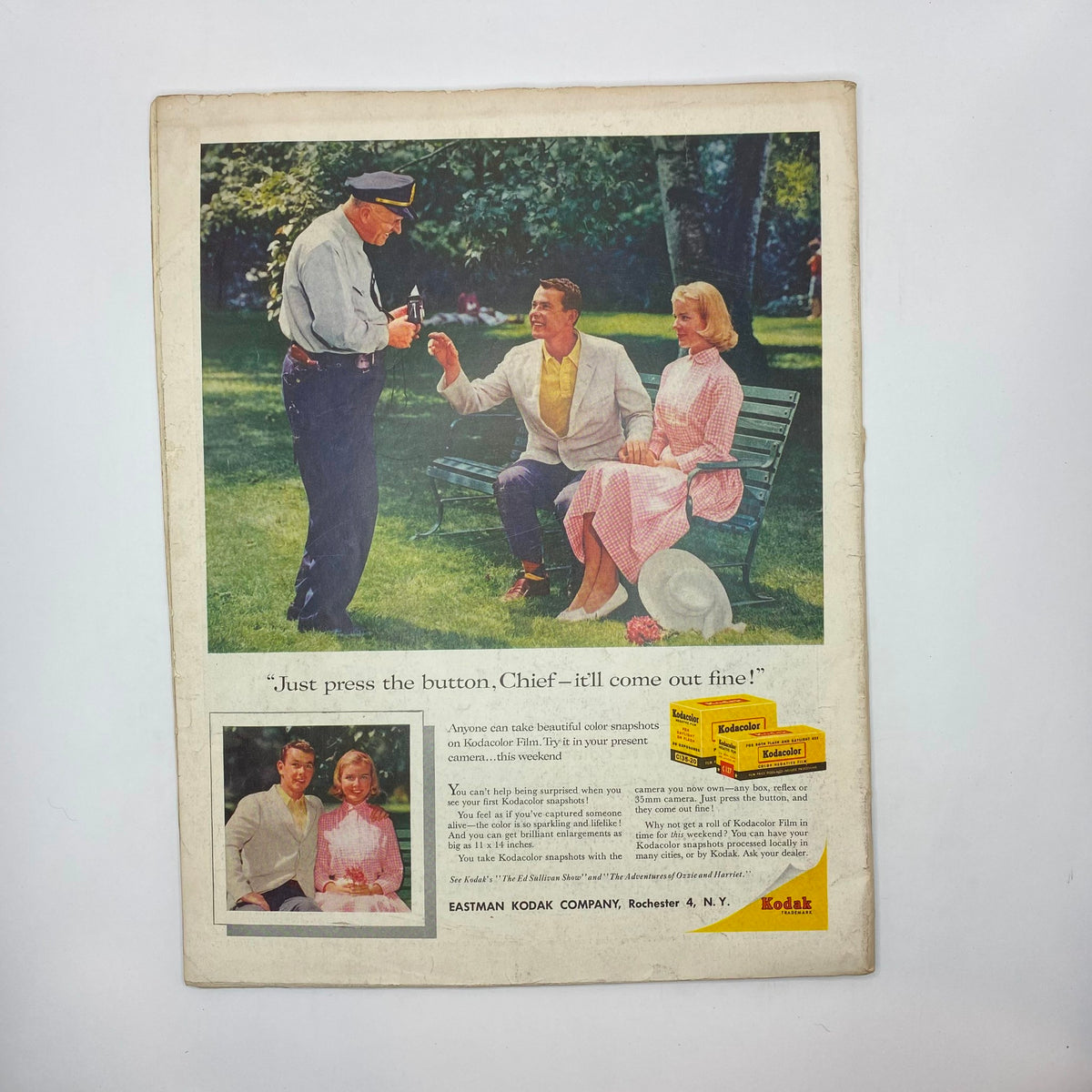 Back cover of Saturday Evening Post Magazine August 23 1958 showcasing a Kodak advertisement with a scene featuring a police officer and a couple enjoying a day in the park.