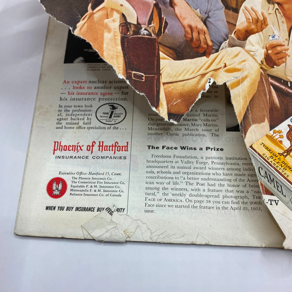 Close-up of an advertisement from the Saturday Evening Post Magazine March 28 1959 showcasing Camel cigarettes and the Phoenix of Hartford insurance.