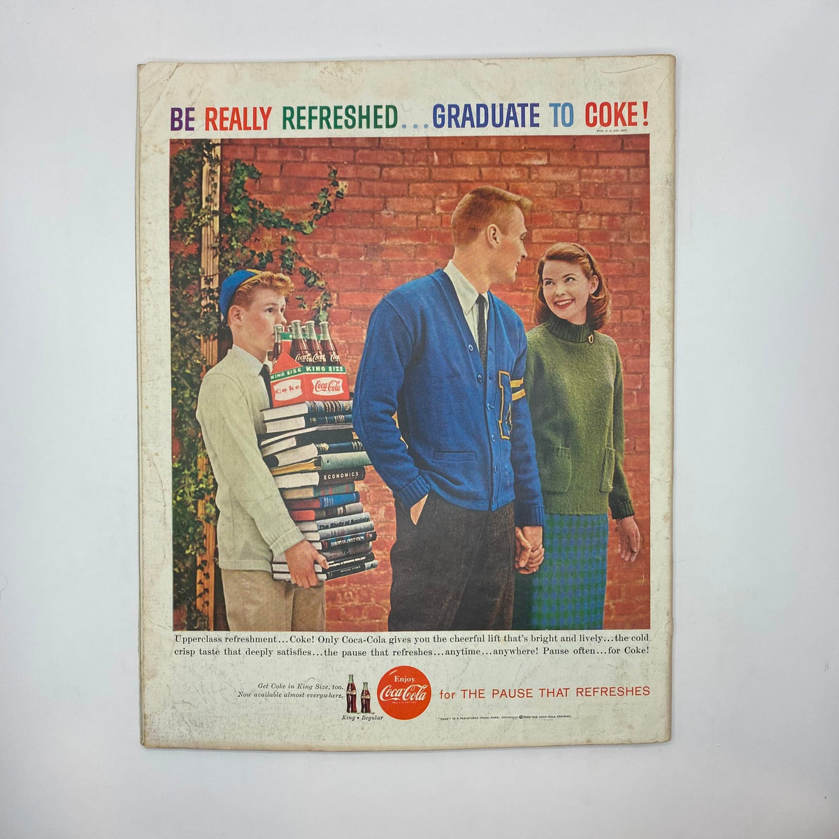 Back cover of the Saturday Evening Post Magazine from September 26, 1959, showcasing a vintage Coca-Cola ad with three young adults, promoting the brand in a collegiate setting.