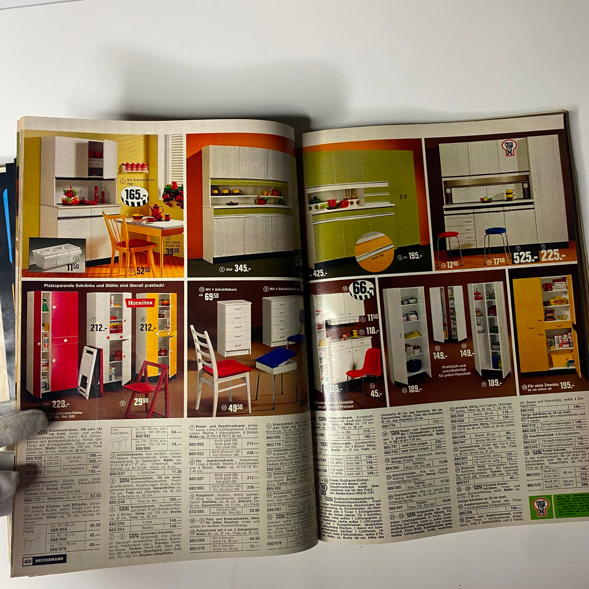 Interior page from the 1974 Neckermann Sommer Catalog displaying colorful kitchen furniture and storage solutions, highlighting affordable and practical designs from mid-1970s Germany.