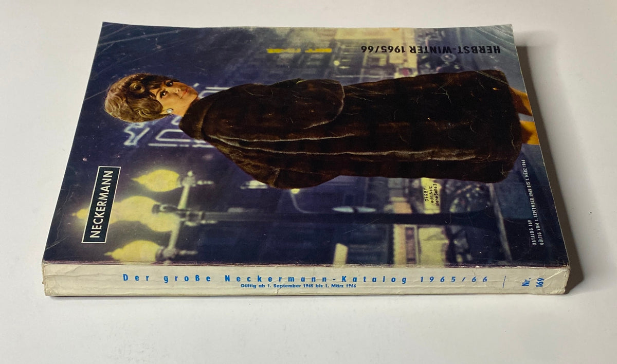 Side view of the 1965-1966 Neckermann Winter Catalog, showing the spine and cover design with the title and a woman in a fur coat.