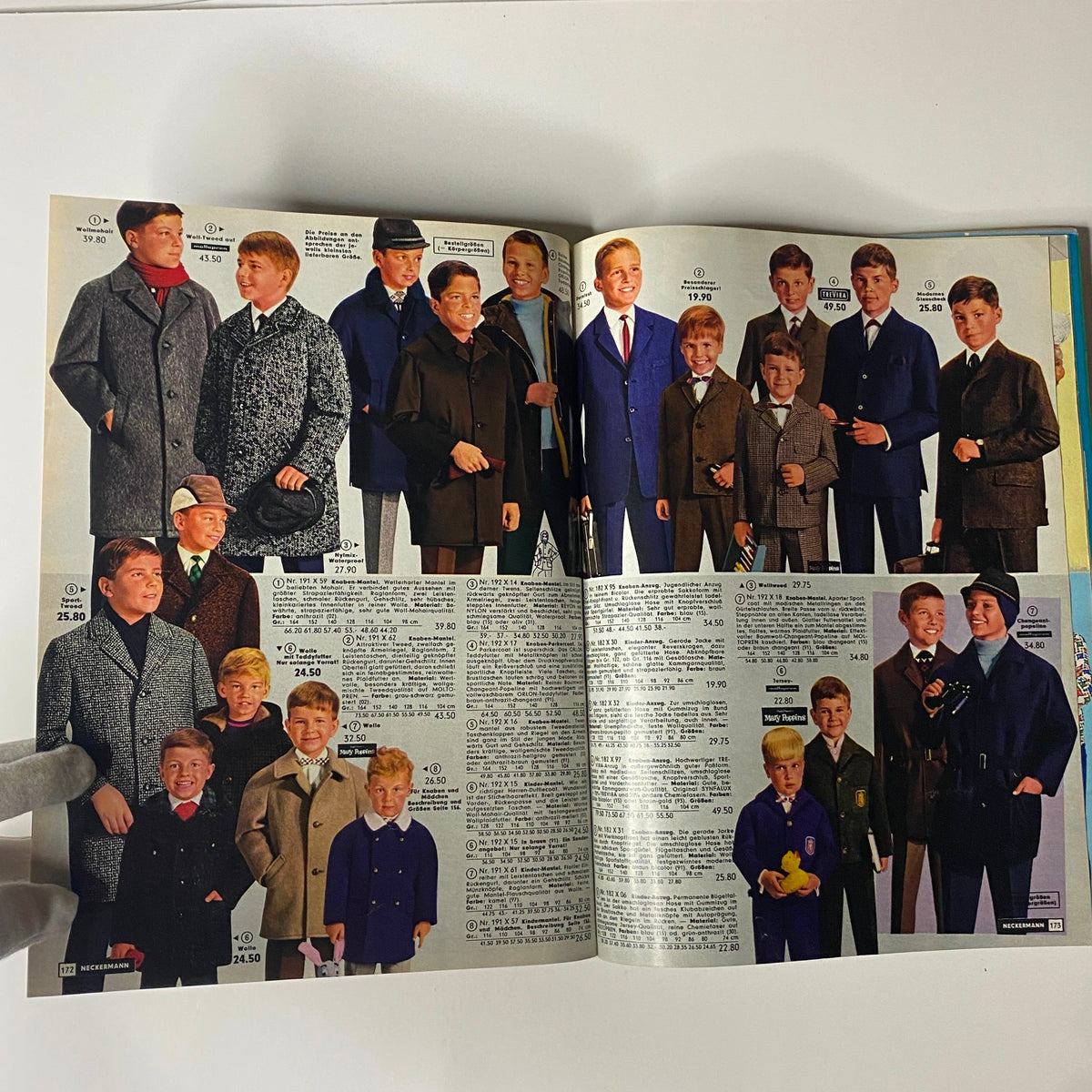 1965-1966 Neckermann Winter Catalog displaying fashionable winter apparel for boys, including coats and formal wear, capturing the essence of 1960s children's fashion.