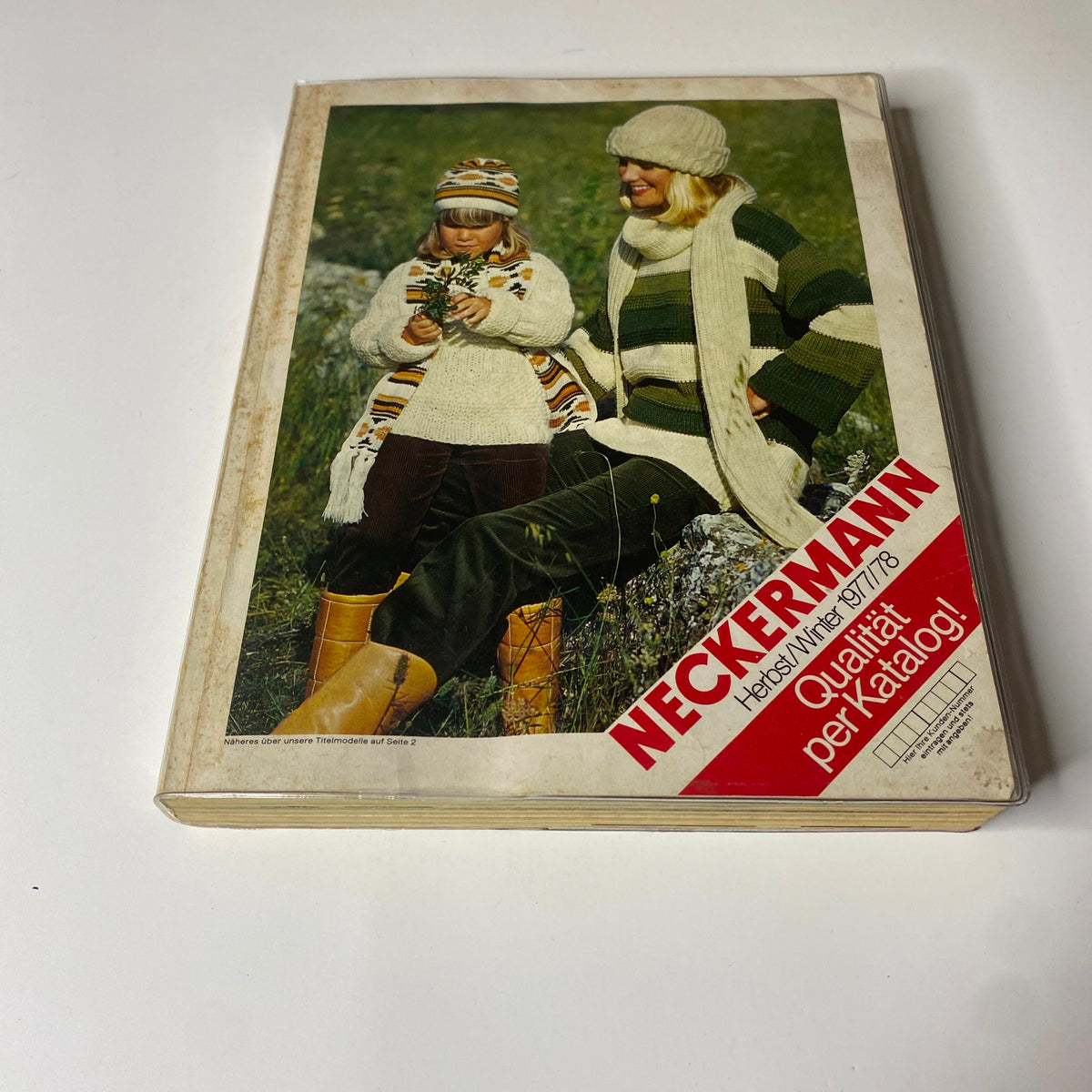 Front cover of the 1977-1978 Neckermann Winter Catalog featuring a woman and a girl in stylish winter attire, showcasing retro fashion and lifestyle products from Germany.