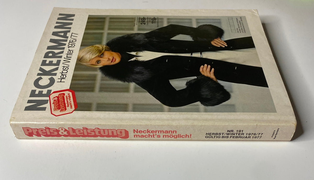 Side view of the 1976-1977 February Neckermann Winter Catalog displaying the same model in a fashionable black coat with fur trim, emphasizing vintage winter wear.