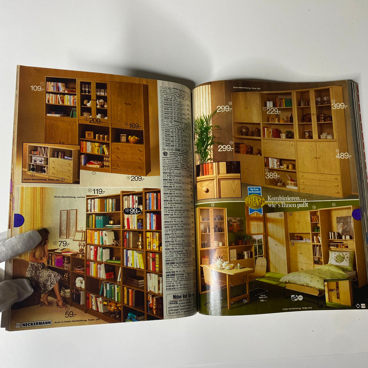 Page from the 1982 Neckermann Summer Catalog showcasing various wooden furniture pieces such as bookshelves and cabinets with pricing information.
