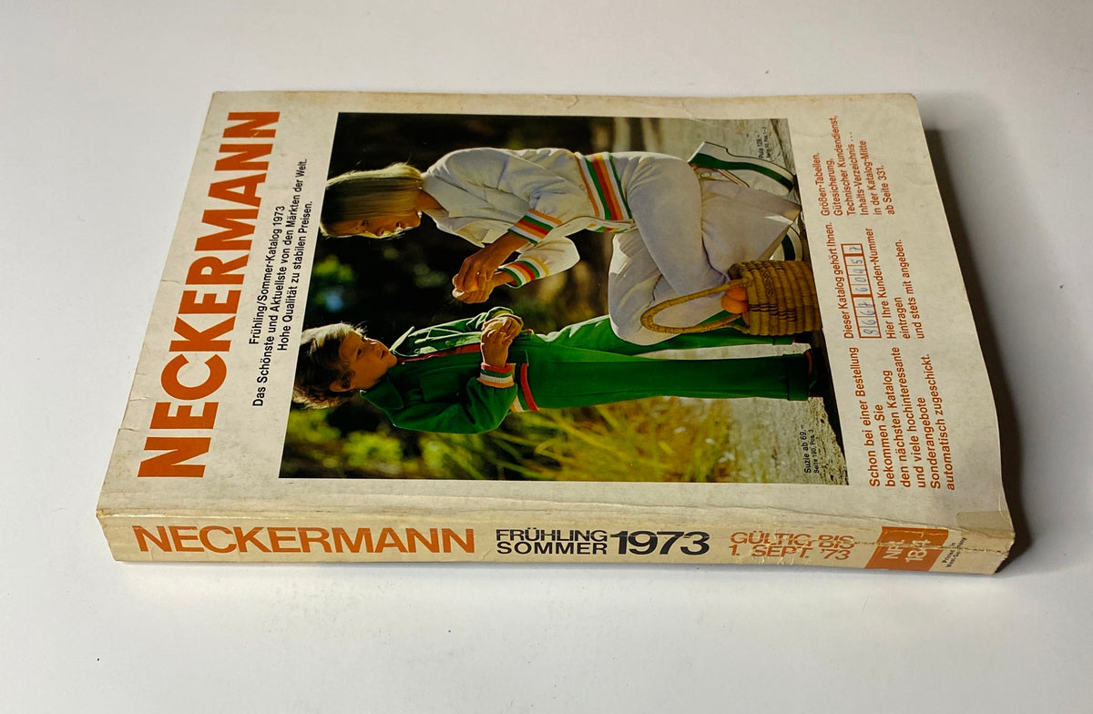 Side view of the 1973 Neckermann Summer Catalog, showcasing its title and colorful imagery, reflecting vintage summer styles and consumer trends.