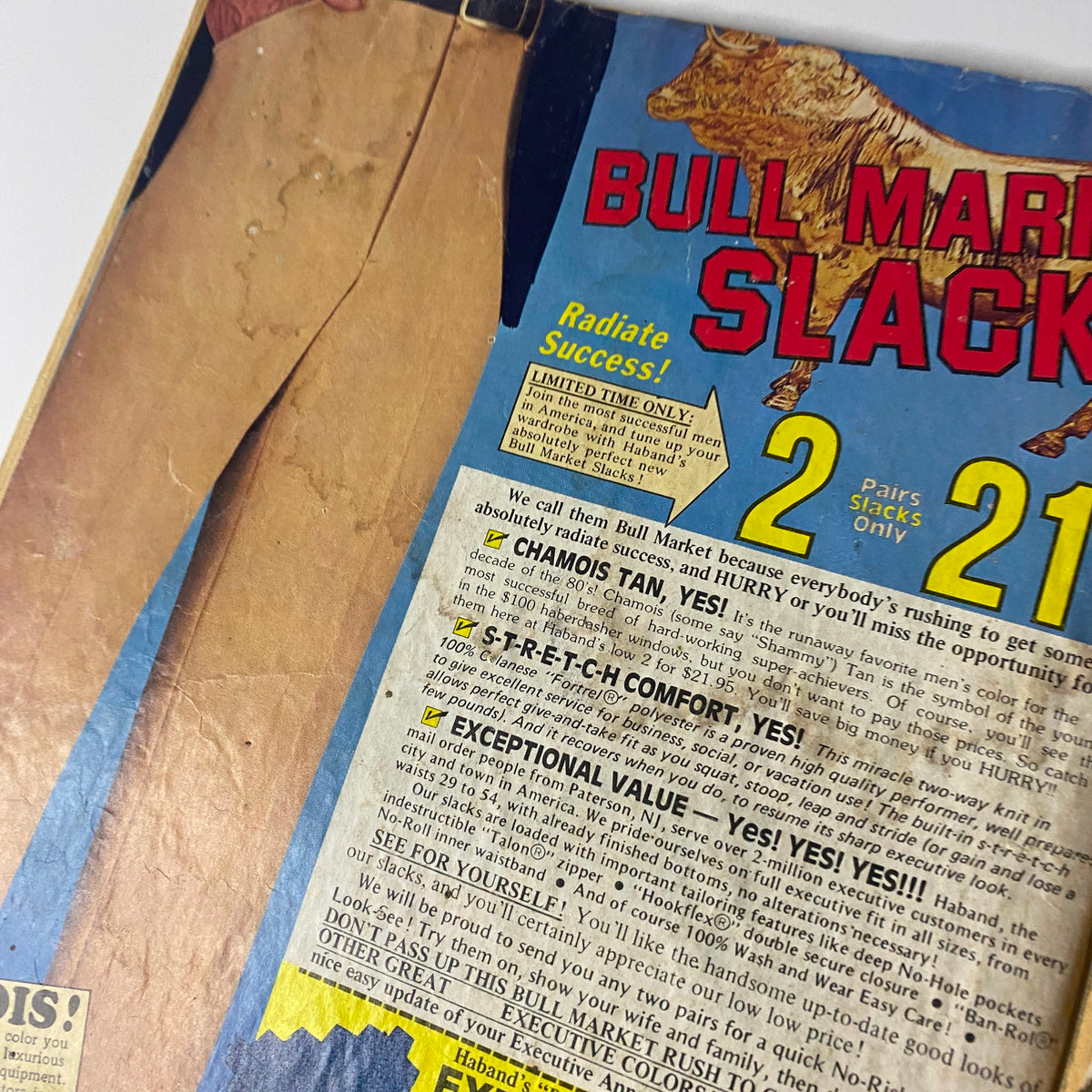 Close-up of a vintage magazine advertisement for Bull Market Slacks from the 1980s, highlighting features such as 'Exceptional Value' and offering two pairs for $21.