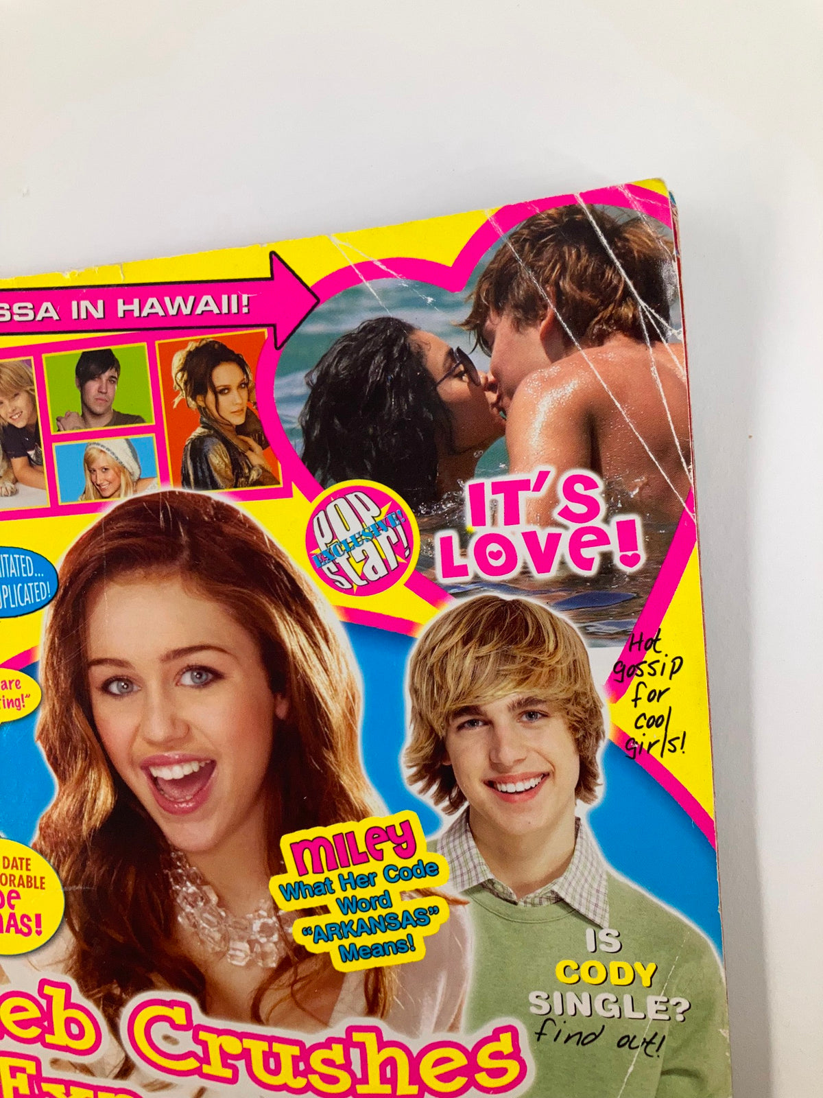 Detail of the cover of Pop Star Magazine July 2007, displaying Miley Cyrus and other young celebrities with colorful elements and headlines related to pop culture.