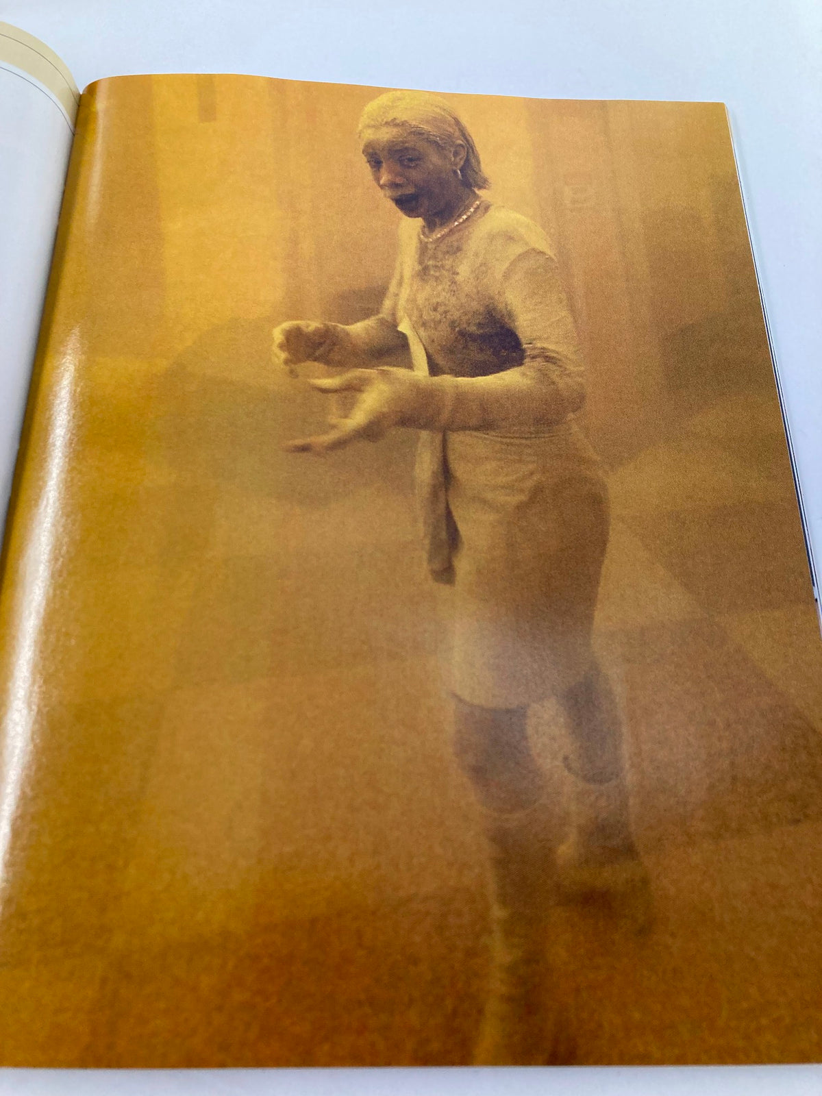 Photo from Newsweek Magazine Fall 2001 The Spirit of America depicting a woman covered in dust after the World Trade Center collapse, symbolizing the impact of 9/11 on ordinary lives.
