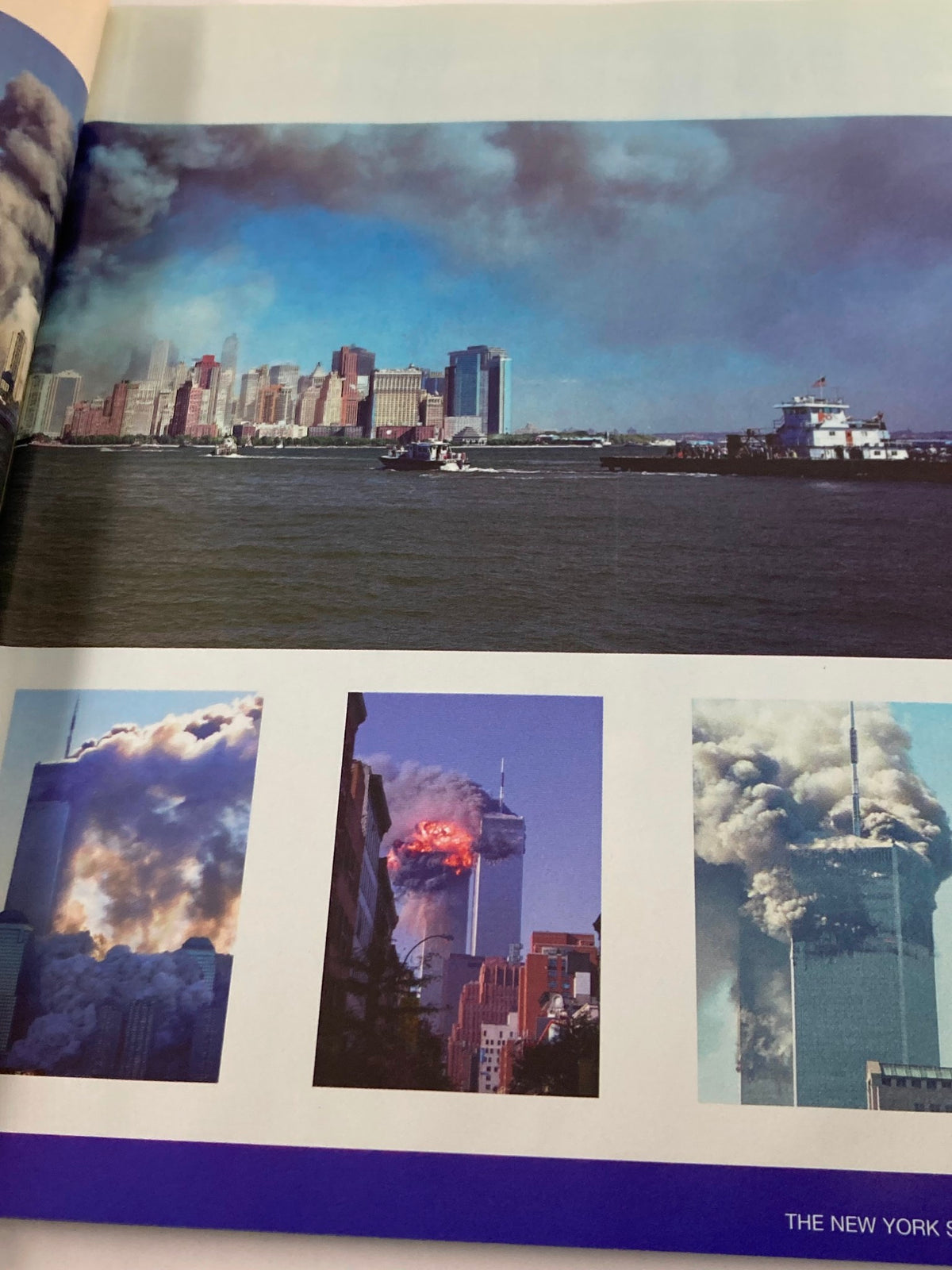 September 11 2001 Standing Strong: The Spirit of New York - A panoramic view of the New York skyline with smoke rising from the World Trade Center following the tragic events of September 11, 2001.