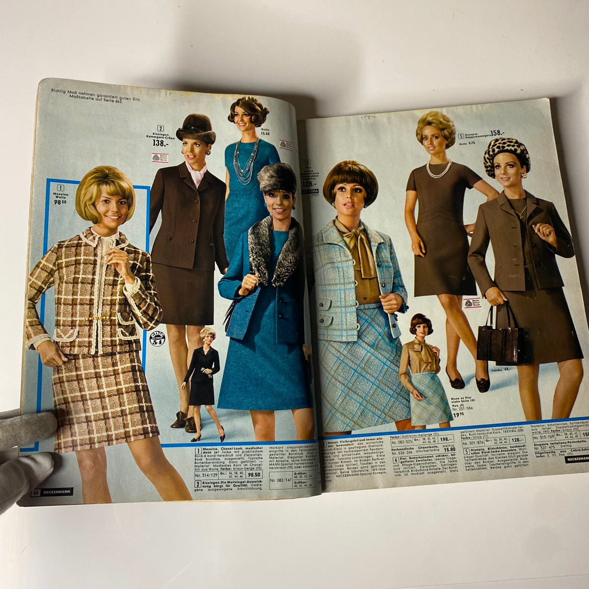 A stylish page from the 1973 Neckermann Summer Catalog displaying fashionable outfits for women including dresses and suits, showing models wearing chic designs popular in the early 1970s.