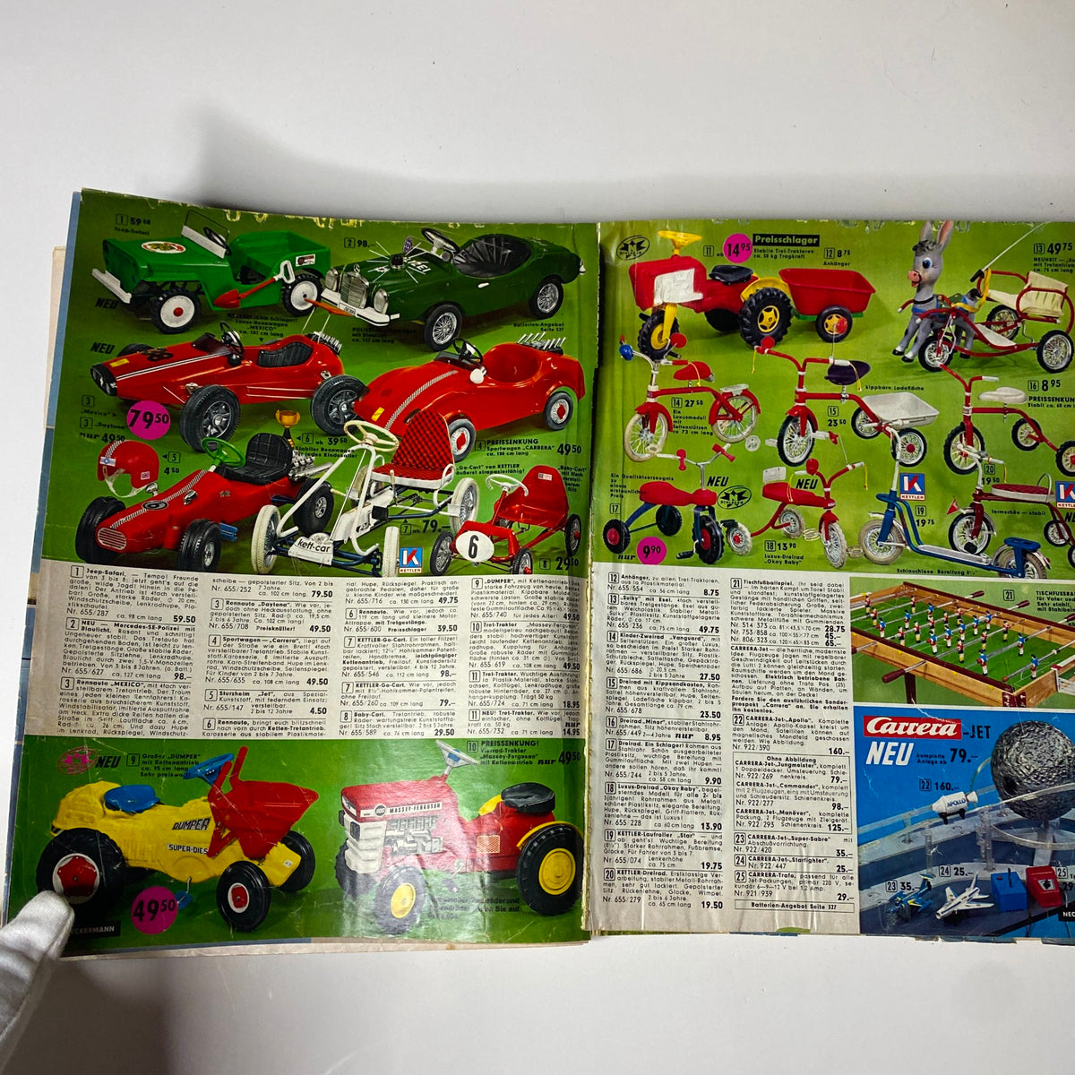 Colorful products featured in the 1973 Neckermann Summer Catalog, displaying vintage children's toy vehicles and pedal cars.