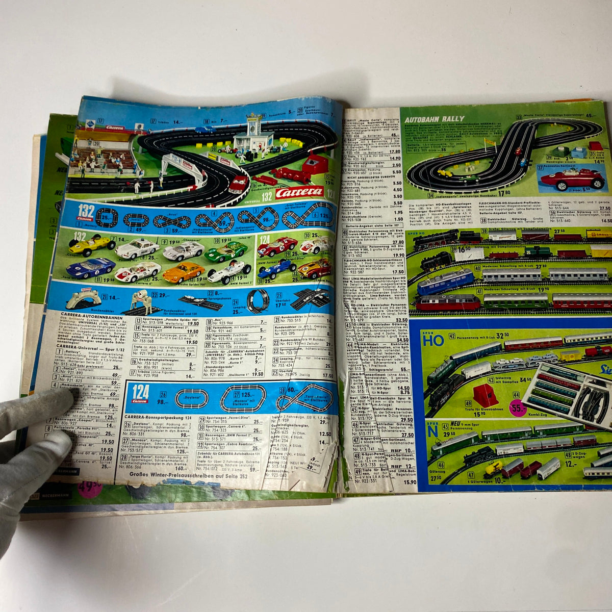 Exciting layout from the 1973 Neckermann Summer Catalog featuring model cars and racetracks, highlighting toy racing and train sets.