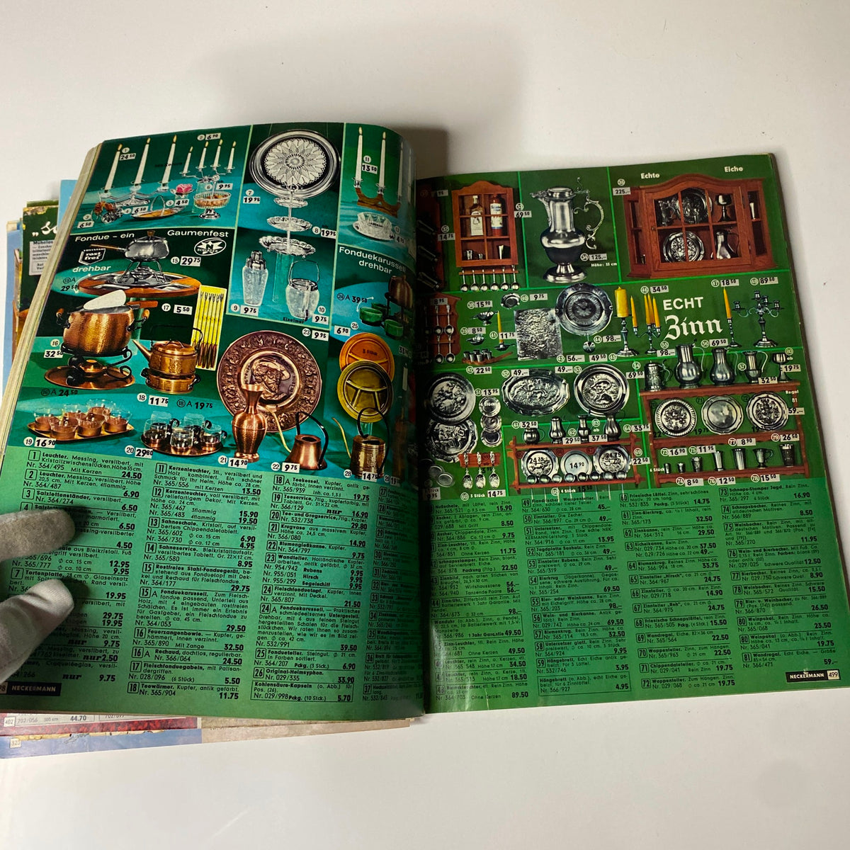 Page from the 1973 Neckermann Summer Catalog showcasing a variety of household items, including cookware, decorative pieces, and tableware, with detailed pricing.