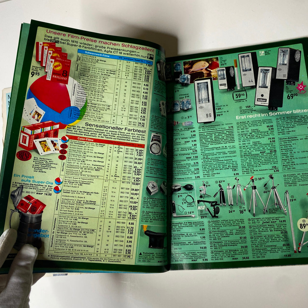 1970 Neckermann Summer Catalog showcasing advertisements for camera accessories and lighting products on a vibrant green page.