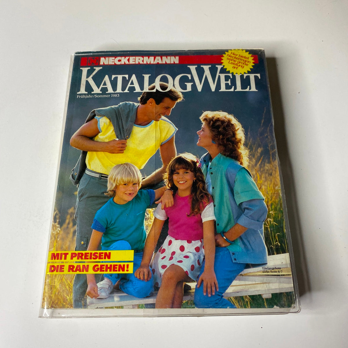 Cover image of the 1983 Neckermann Summer Catalog, featuring a family dressed in vibrant summer clothing, highlighting fashion options from early 1980s Germany.