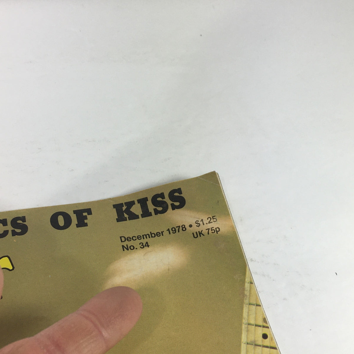 Close-up of the corner of the VTG Trouser Press Magazine: December 1978 with visible text about the issue's date, price, and notable content, focusing on rock history.