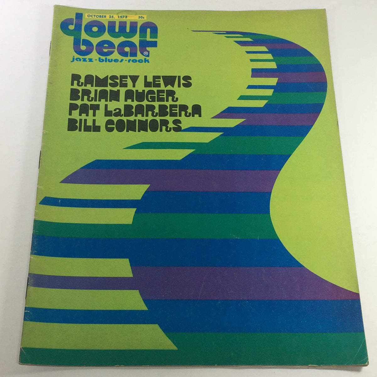 Cover of VTG Down Beat Music Magazine: October 25, 1973 featuring bold graphics and colors, highlighting artists Ramsey Lewis, Brian Auger, Pat LaBarbera, and Bill Connors.