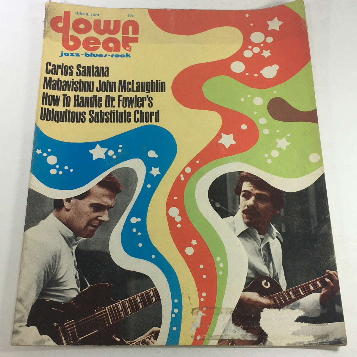 Vintage Down Beat Magazine from June 6, 1974, featuring Carlos Santana and Mahavishnu John McLaughlin on the cover, showcasing the vibrant jazz and rock scenes of the 1970s.
