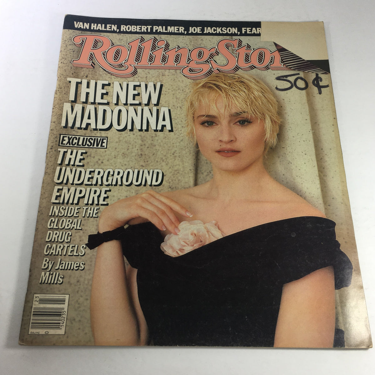Vintage Rolling Stone Magazine cover from June 5, 1986, featuring The New Madonna. The magazine showcases a portrait of Madonna with short hair, wearing a black dress and holding a flower, highlighting her iconic style during the 80s.