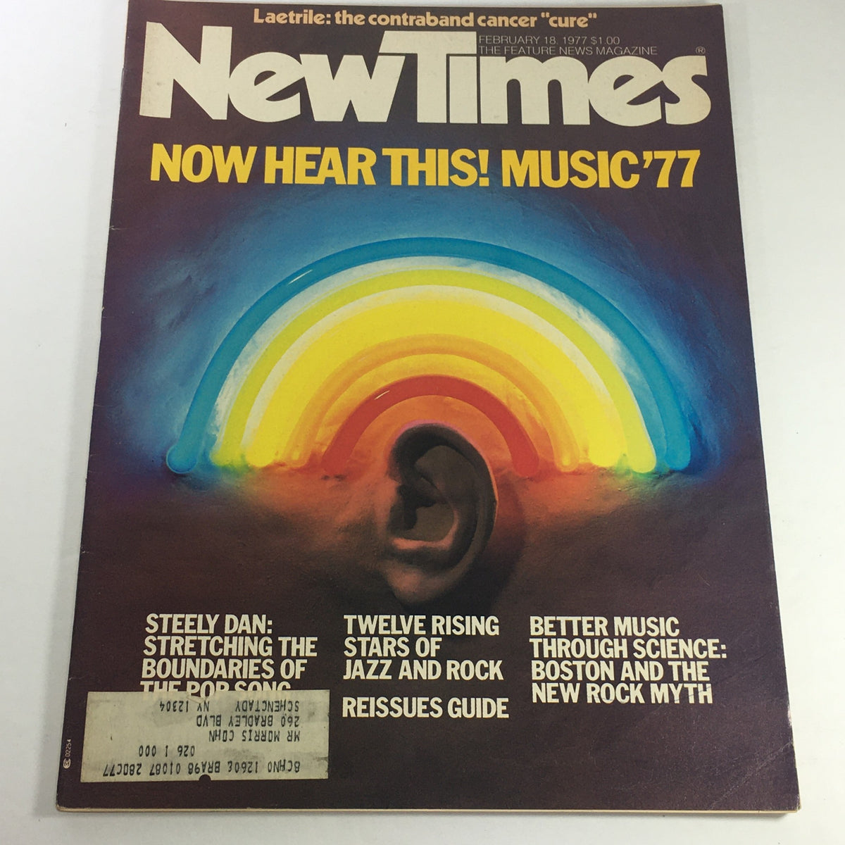 VTG New Times Magazine Cover from February 18, 1977 featuring Steely Dan and the headline 'Now Hear This! Music '77' showcasing a colorful rainbow design and articles about jazz and rock.