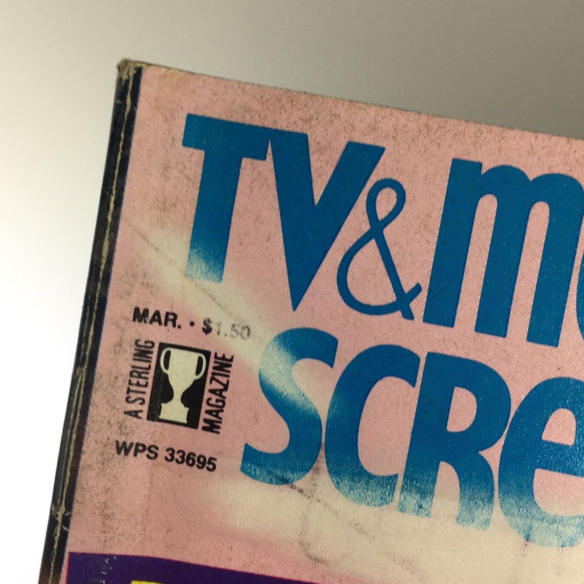 Close-up view of the March 1983 issue of TV & Movie Screen magazine, prominently displaying the title 'TV & Movie Screen' in bold blue lettering on a pink background, featuring pricing and publication details. This collectible magazine includes stars like Linda Evans and Joan Collins.