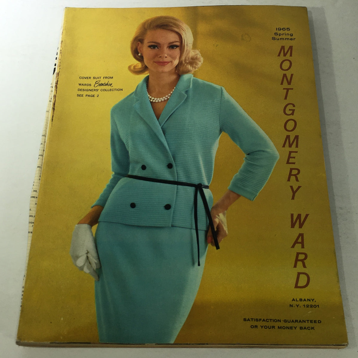 Cover of the VTG Montgomery Ward Catalog: Spring & Summer 1965 featuring a model in a vintage turquoise suit, showcasing summer fashion styles.