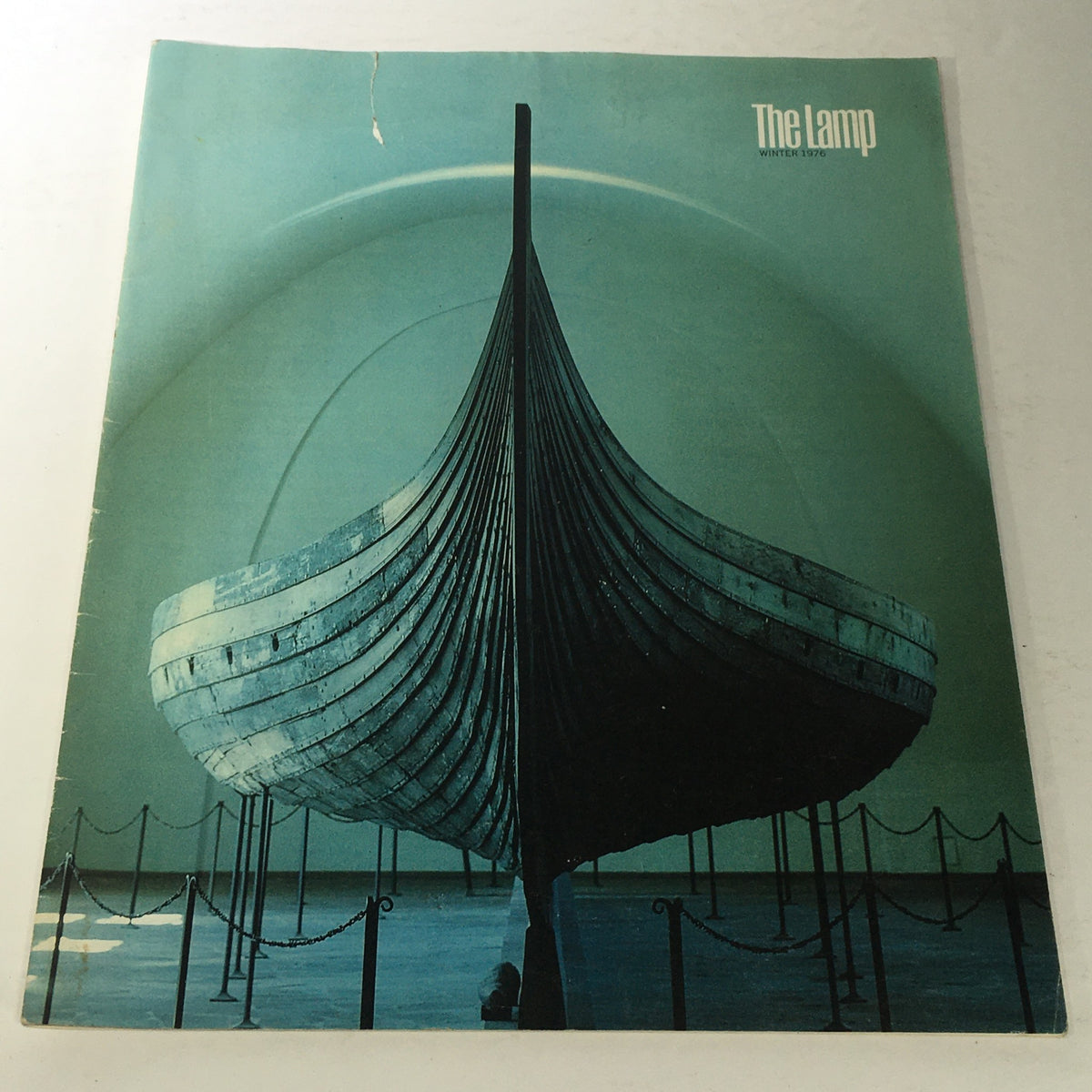 Vintage magazine cover of The Lamp: Winter 1976 featuring a striking Viking ship design, encapsulating 1970s art and culture.
