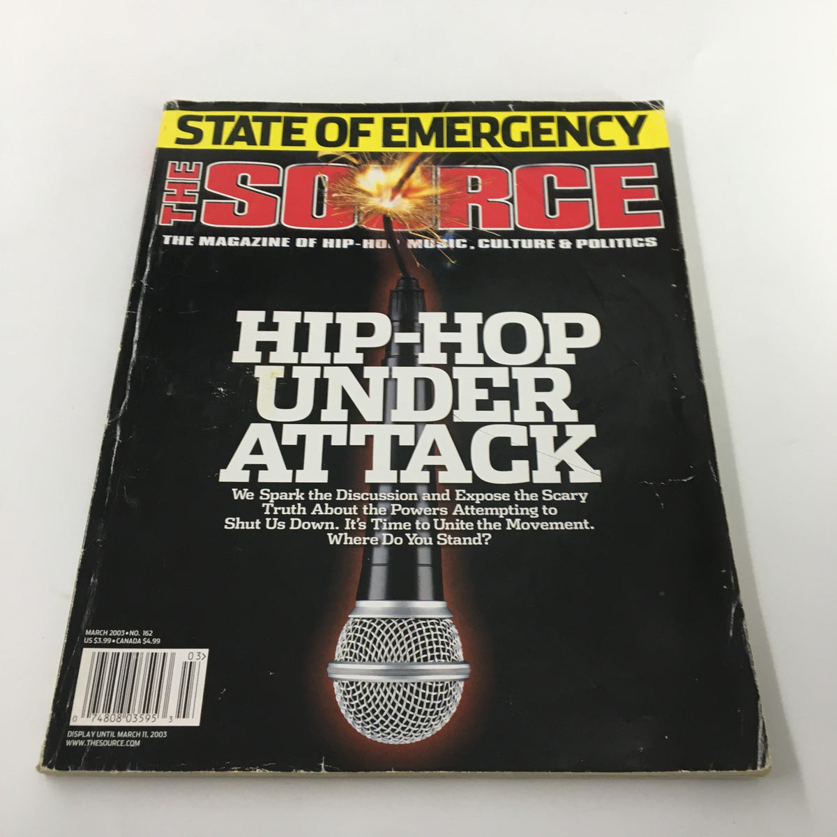 Cover of The Source Magazine March 2003 No. 162 featuring the title 'HIP-HOP UNDER ATTACK' with an image of a microphone and a bold statement about the discussion of power dynamics in music and culture.