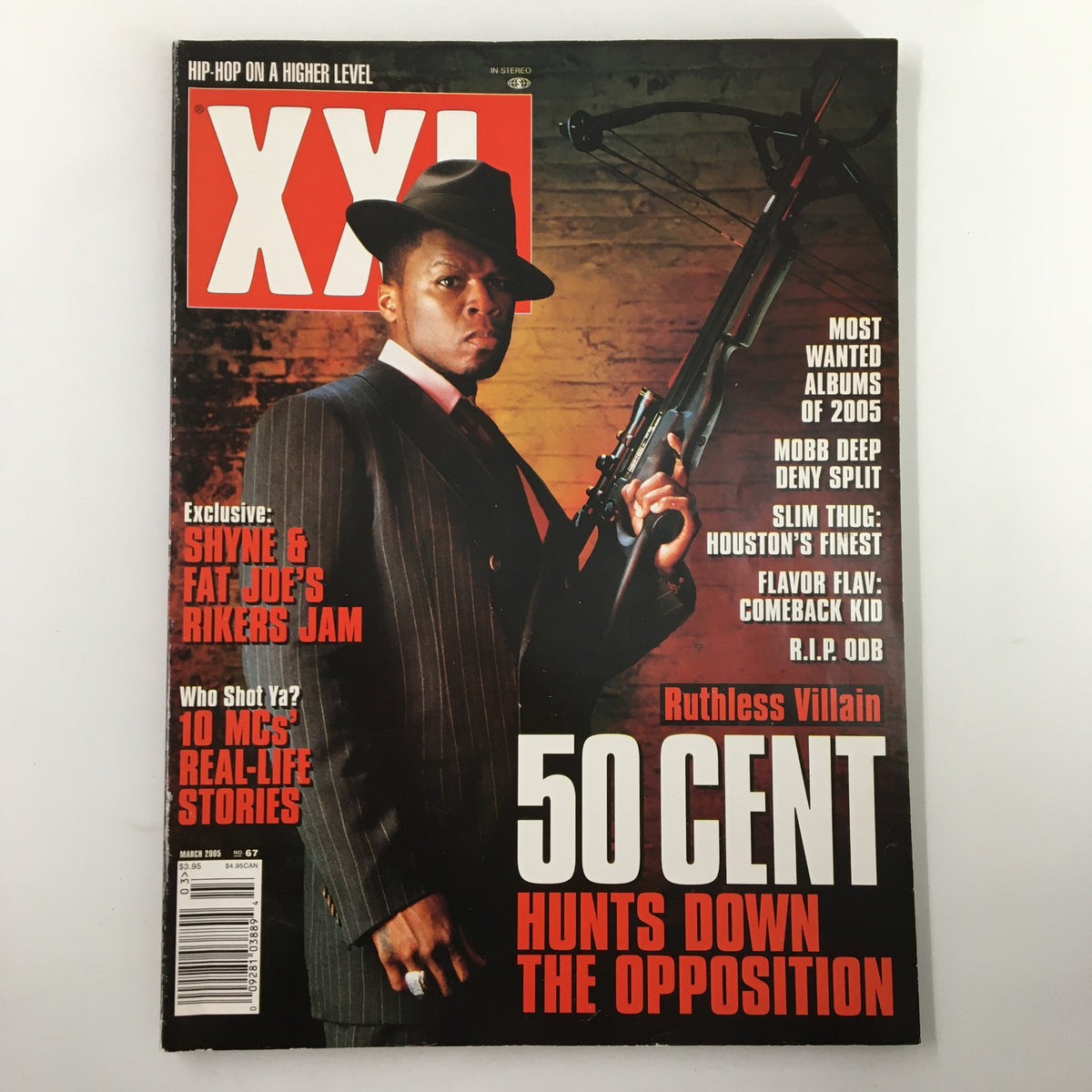 Cover of XXL Magazine March 2005 featuring 50 Cent titled 'Hunts Down The Opposition.' The image showcases 50 Cent posing with a firearm, reflecting the intense energy of hip-hop culture in the mid-2000s, emphasizing the magazine's focus on iconic figures in music.