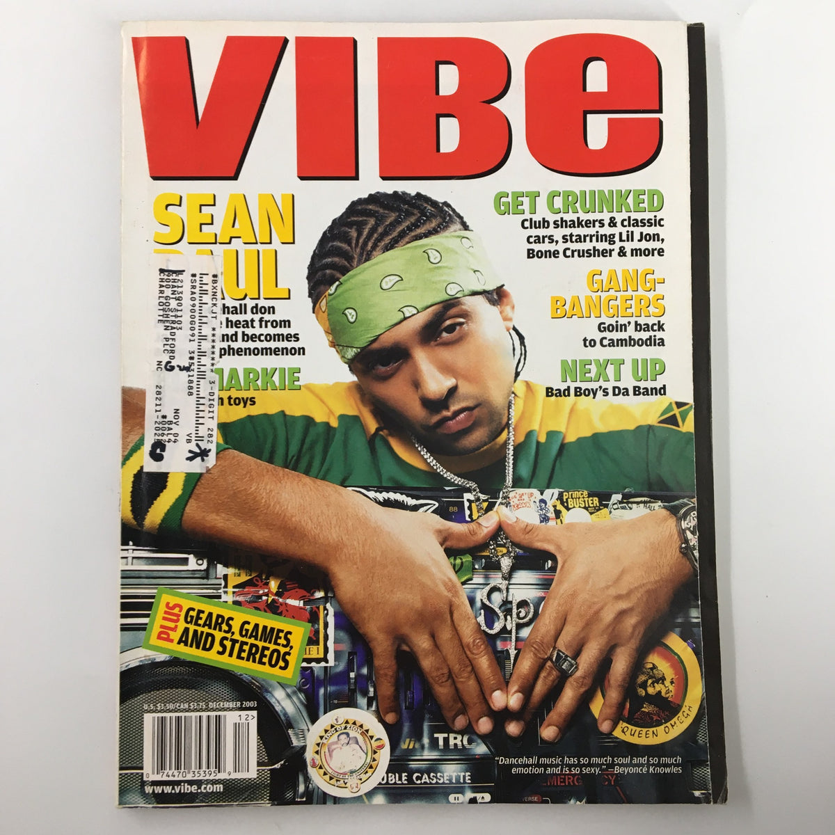 VIBE Magazine December 2003 cover featuring Sean Paul, Biz Markie, and Jessica Alba. Sean Paul is shown in a vibrant outfit, exuding confidence. The issue highlights the pulse of early 2000s pop culture.