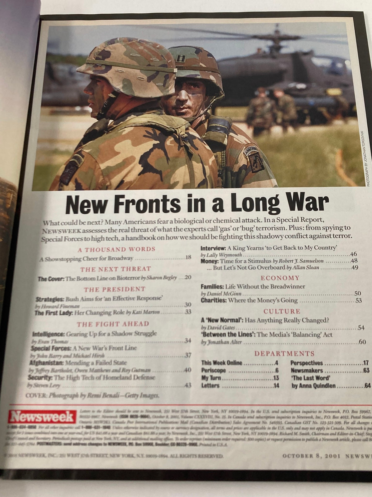 Inside page of Newsweek Magazine from October 8, 2001 displaying soldiers in camouflage with the headline 'New Fronts in a Long War', discussing military responses to biological threats.