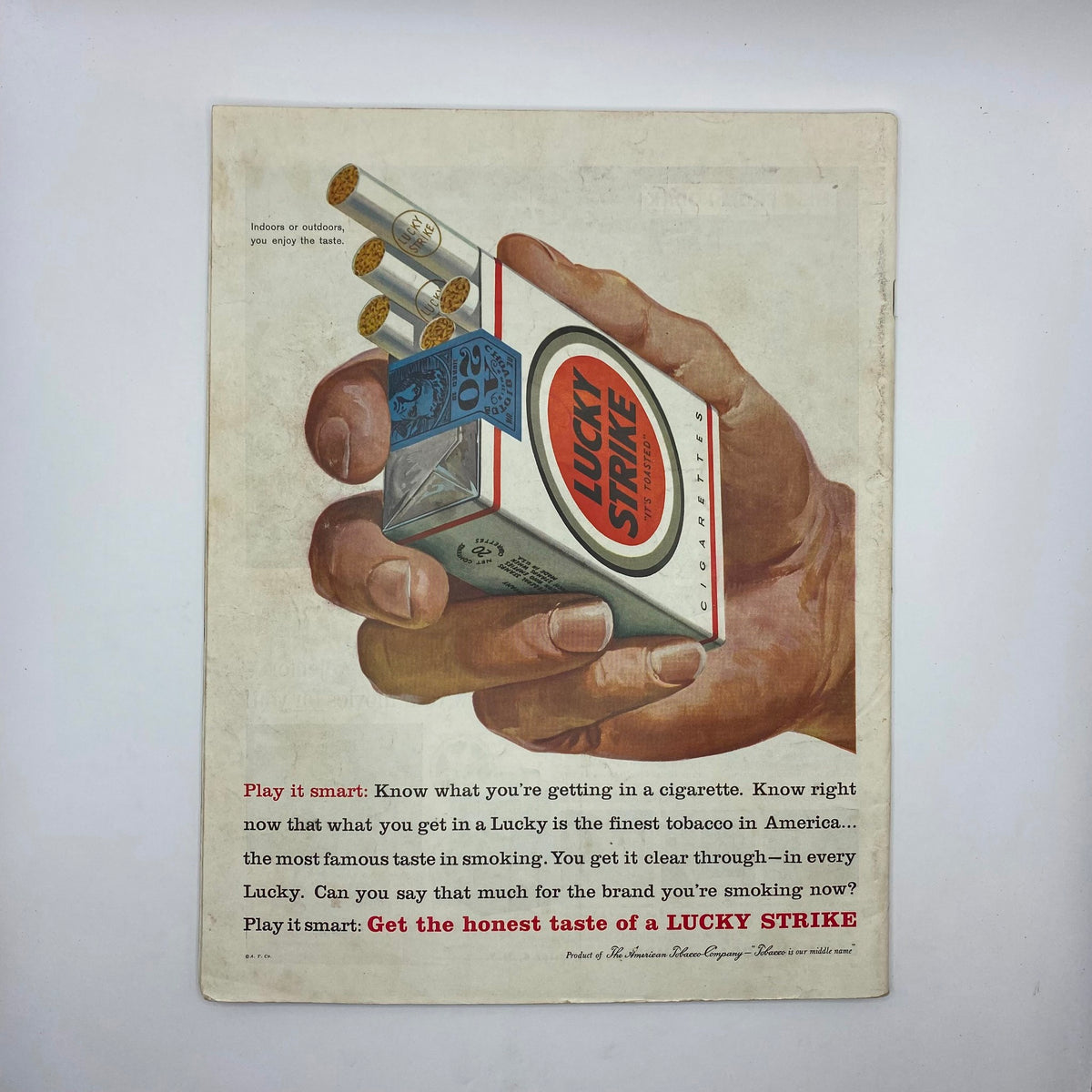 Back cover of the Saturday Evening Post Magazine from May 23, 1959, featuring an advertisement for Lucky Strike cigarettes, depicting a hand holding the cigarette pack.