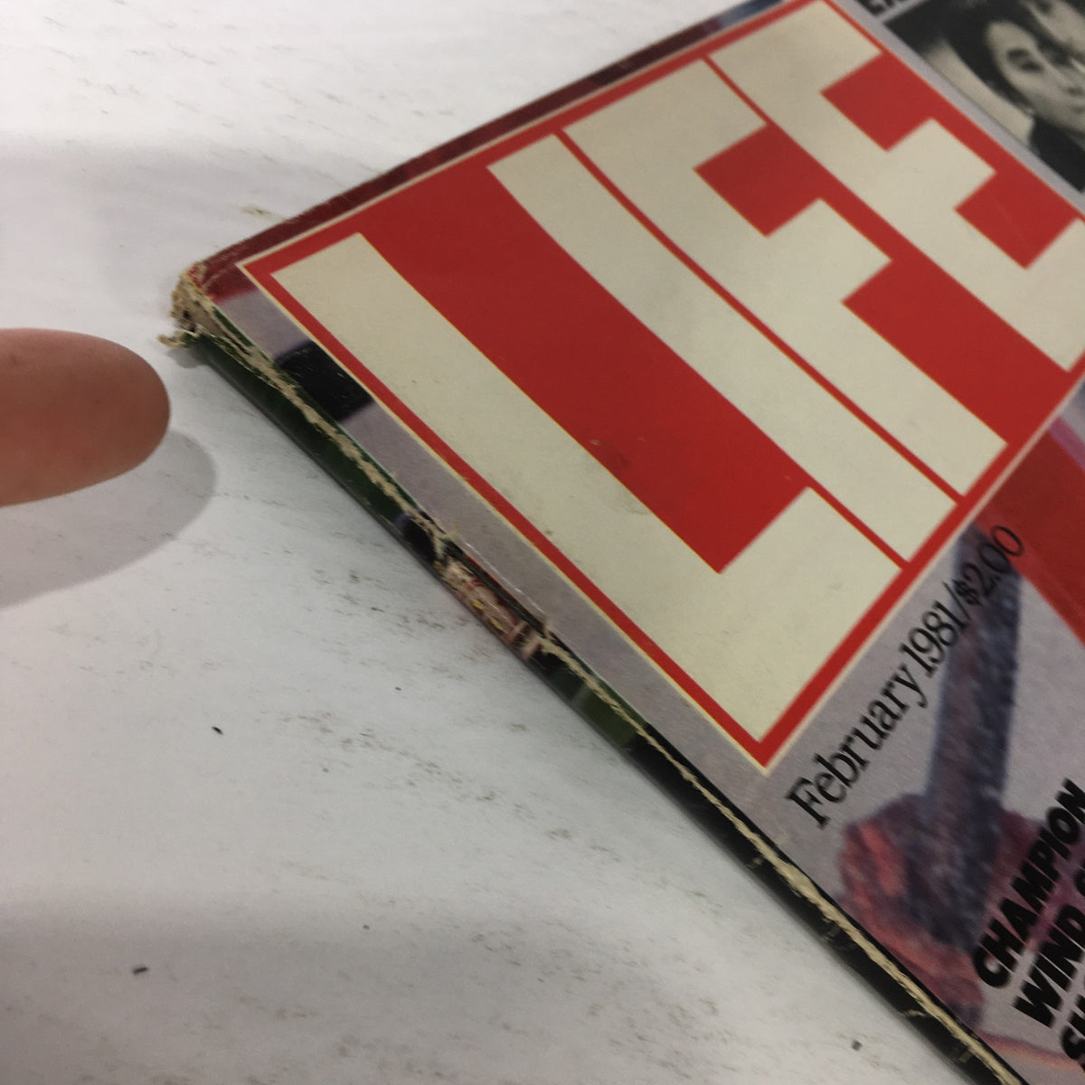 Side view of VTG Life Magazine: February 1981 showing the binding and edge wear, emphasizing its vintage character and the exclusive content on John Lennon.
