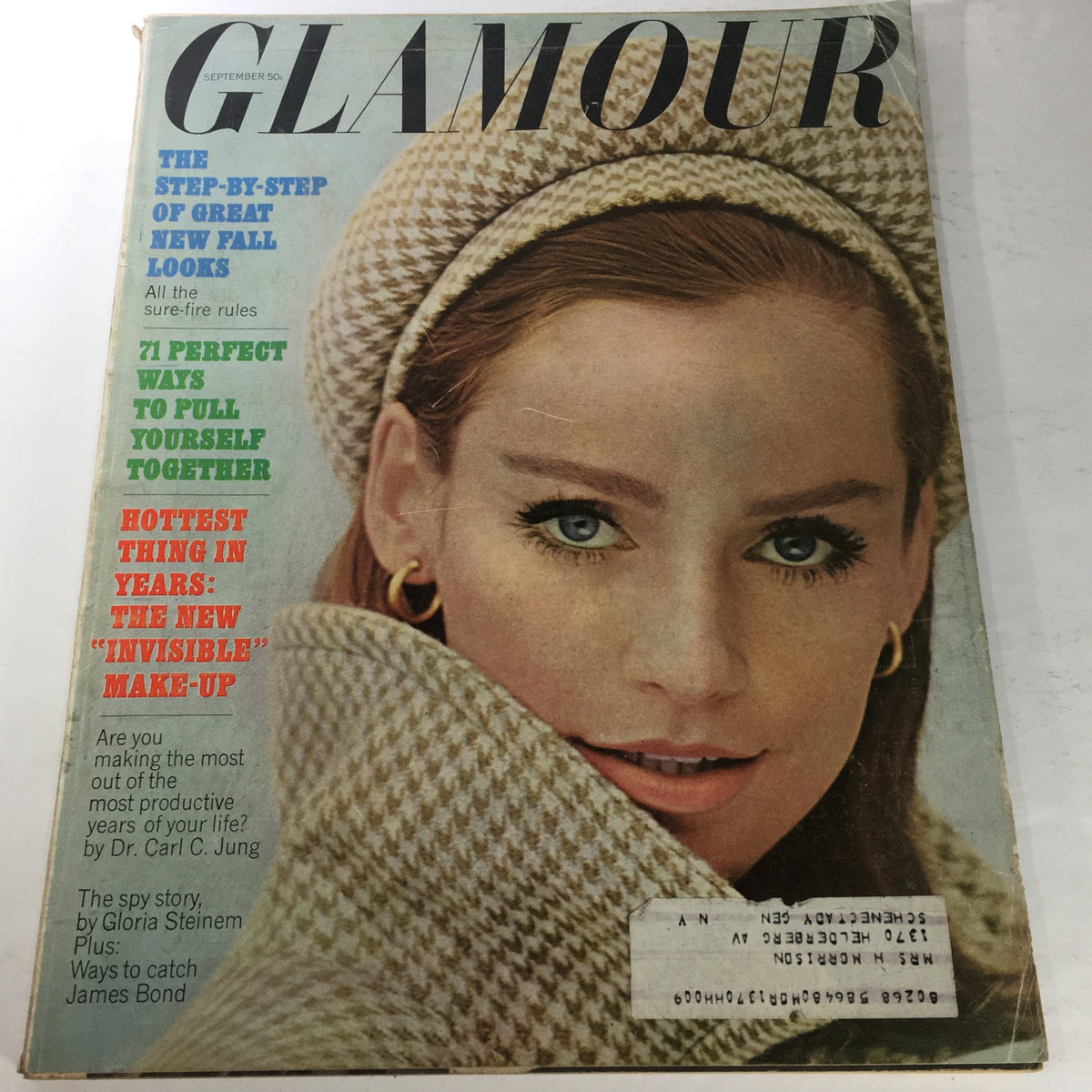 VTG Glamour Magazine: September 1964 featuring a close-up of a stylish model with captivating eyes and a fashionable outfit, showcasing the elegance and fashion trends of the 1960s.