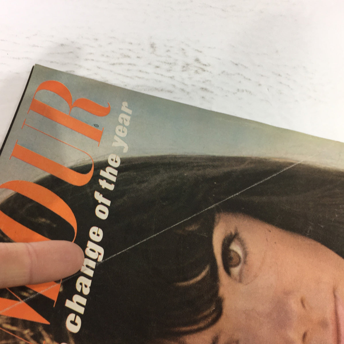 Corner view of the VTG Glamour Magazine April 1965, emphasizing the cover's bold typography and vintage style from the 1960s.