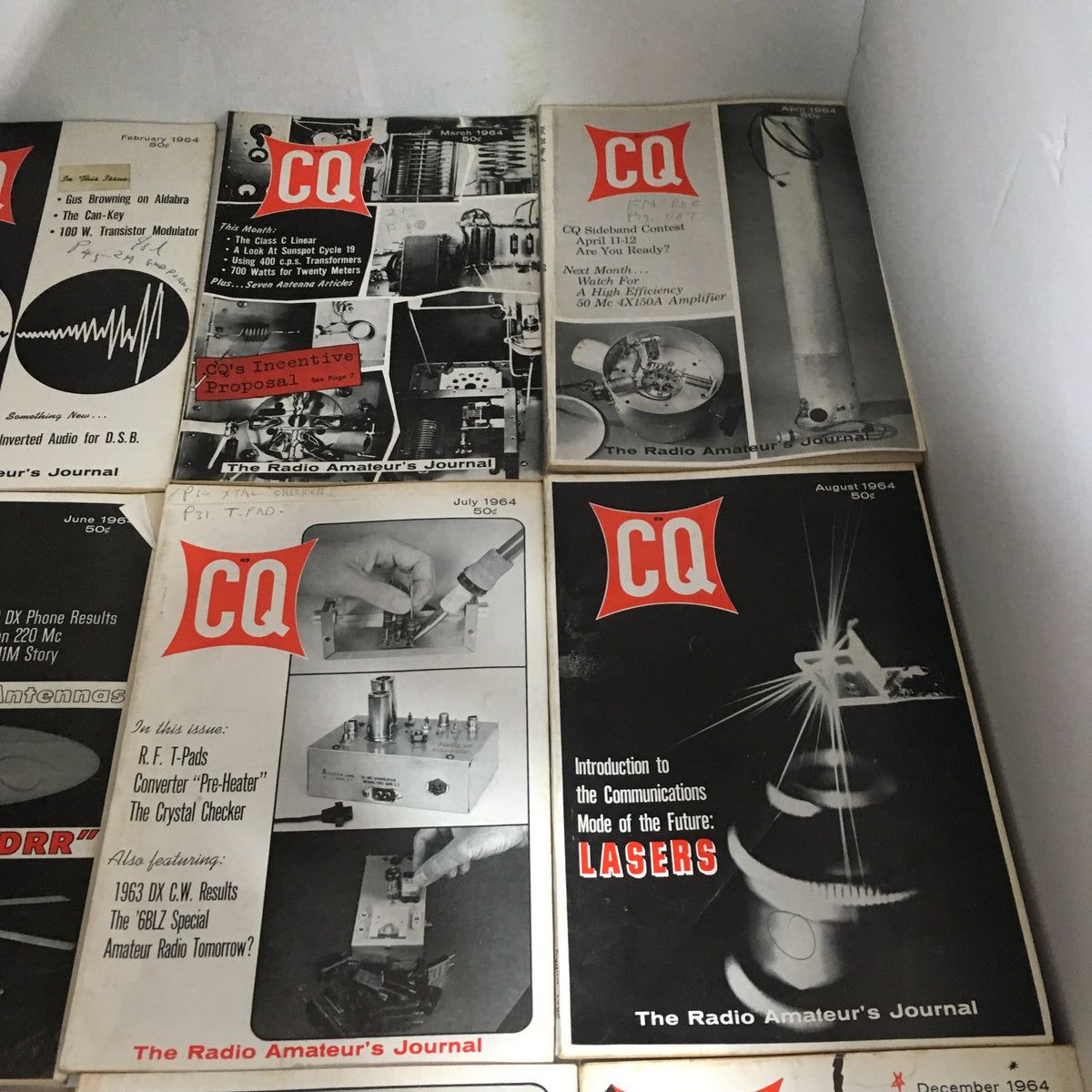 Collection of publications from CQ The Radio Amateur's Journal from 1964, featuring diverse engineering and amateur radio themes illustrated on the magazine fronts.