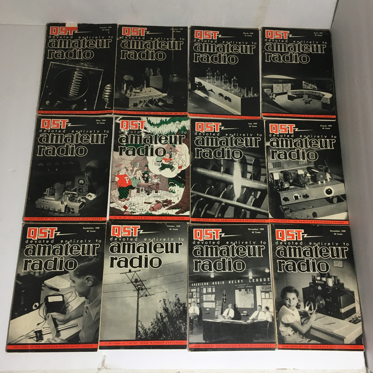 Lot of 12 Complete January to December 1948 QST Amateur Radio magazines arranged in a grid showcasing cover designs.